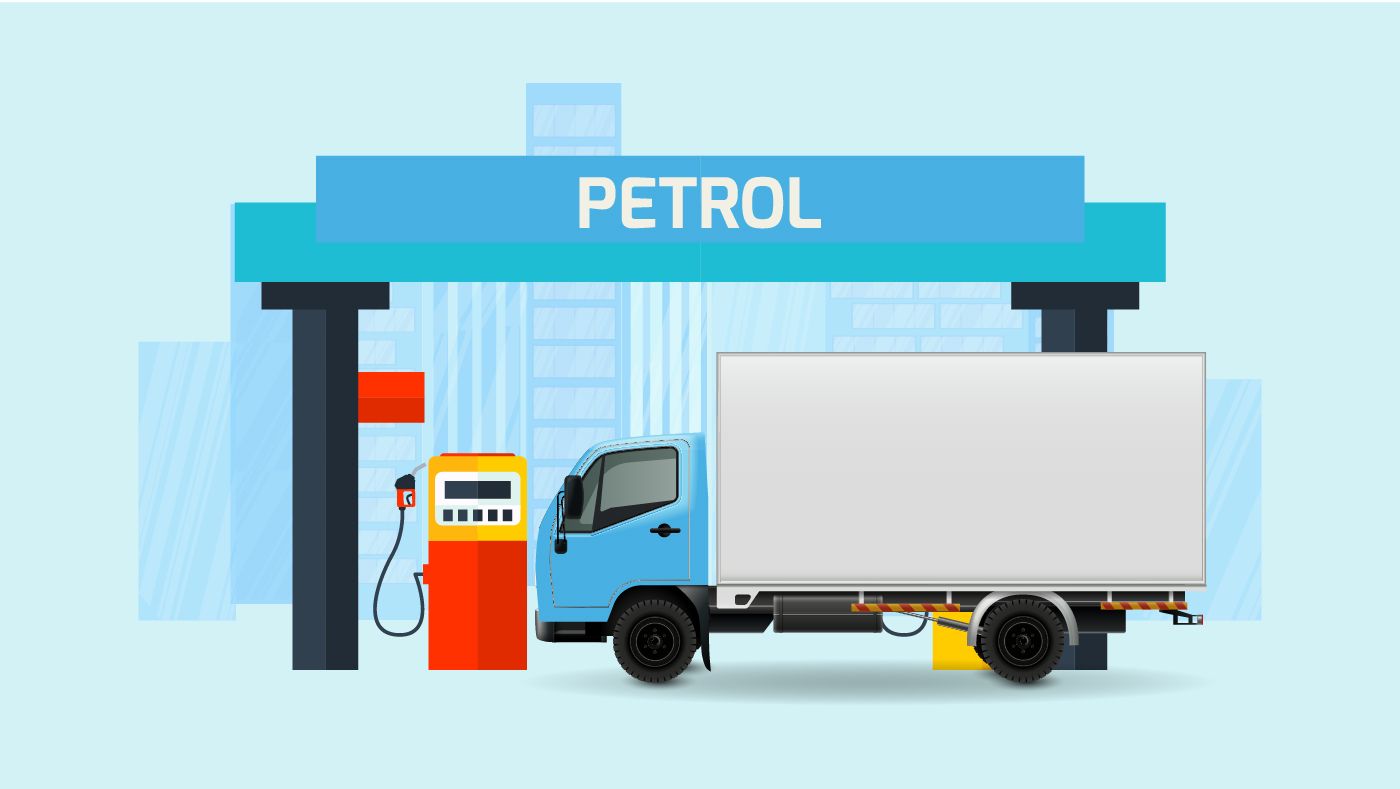 Truck refuelling at a petrol station, illustrating fleet fuel management and fuel efficiency in commercial transportation.